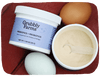 Grubbly Farms prebiotics and probiotics product with eggs on a red background